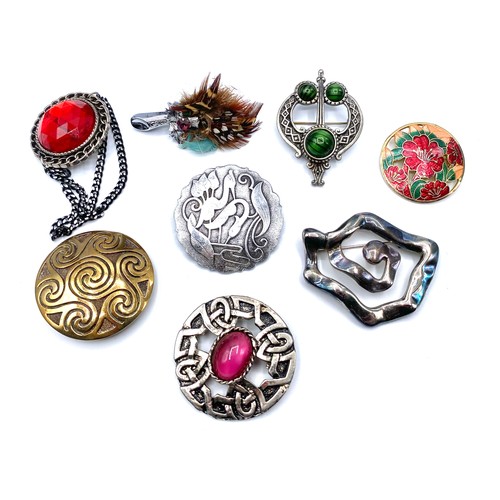 740 - 8 Celtic style brooches.