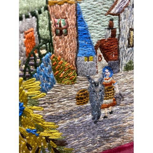 1244 - Vintage hand embroidered coastal town scene in velvet frame 44 x 33 cm.