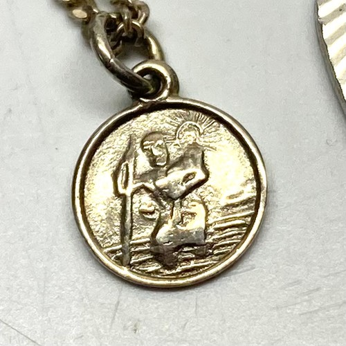 901 - Three silver saint Christopher's including a small one with a silver chain.