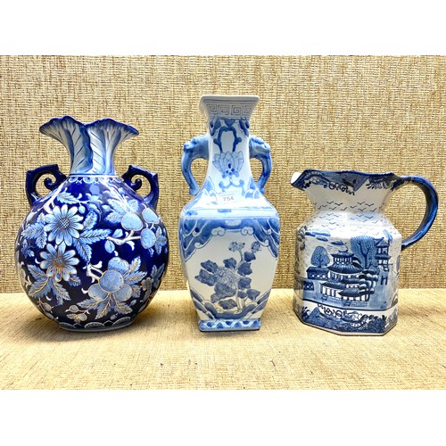 754 - Two large blue and white ceramic vases 36cm and 33cm and a Ironstone blue and white Jug.