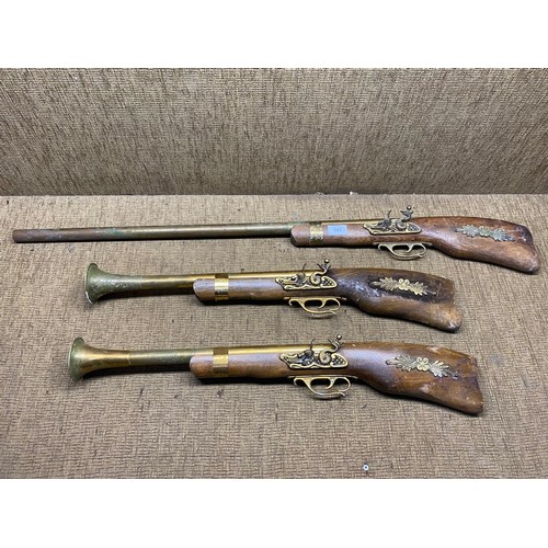 761 - Three decorative wall hanging muskets.