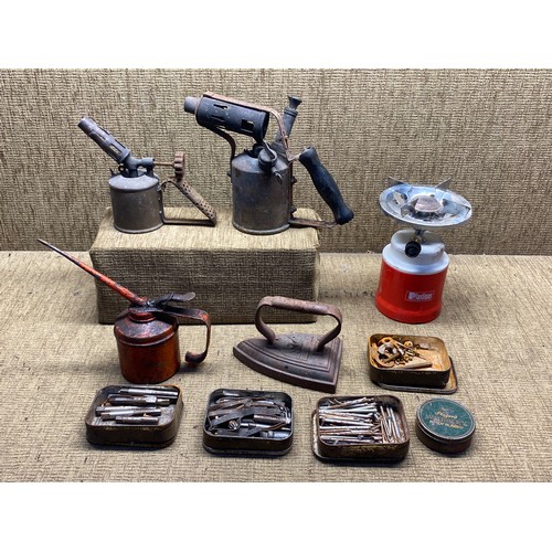 1265 - Selection of Butane and paraffin lamps tins of fixings and a vintage oil can.