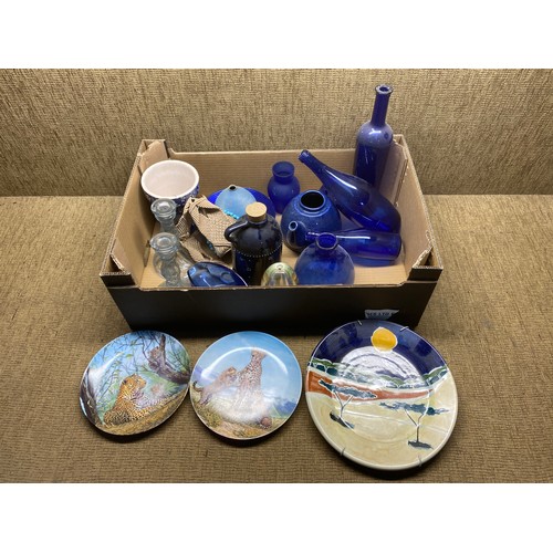 344 - Selection of blue glass items including bottles and ceramic plates.