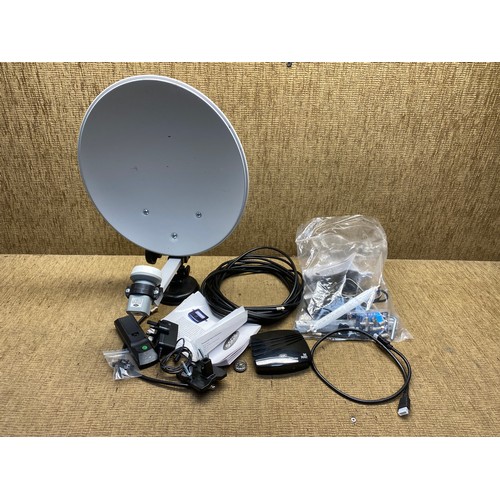 351 - Mobile home satellite system including dish , remote and receiver .