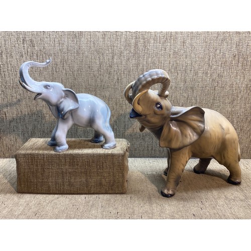 529 - Large ceramic elephants , slight damage to both. Largest 40 cm tall . Smallest 28 cm tall.