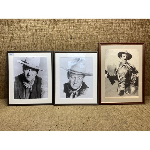 785 - Three framed John Wayne prints . Largest 52x39 cm.