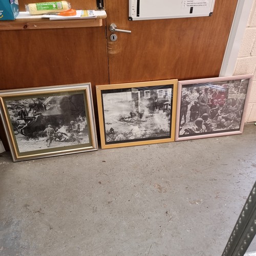 8 - Three framed screen prints from war films, The Longest day, The Pacific and First to fight.