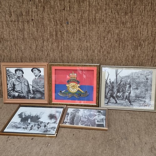 9 - Four war film screen prints and a Royal artillery framed emblem.