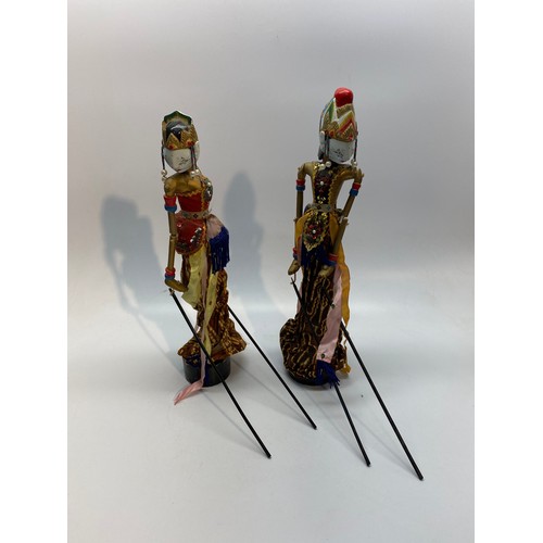 669 - Two Wayang Golex wooden doll puppets.