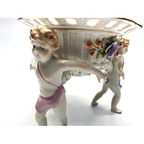 682 - Plaue Schierholz porcelain center bowl cherubs - hand painted and applied floral - circa 1973-1991.