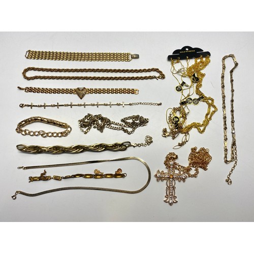 708 - Collection of yellow metal costume necklaces and bracelets.