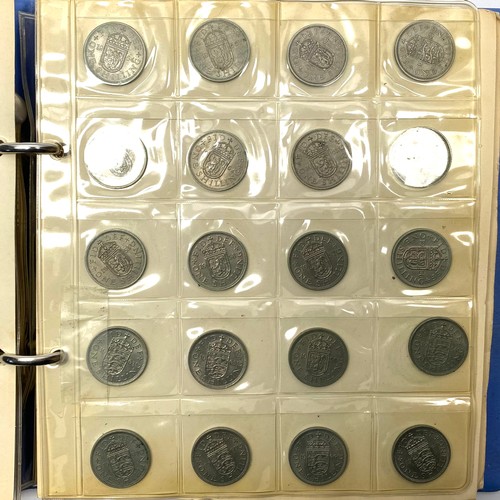 853 - Two books of British and world coins including some silver content.