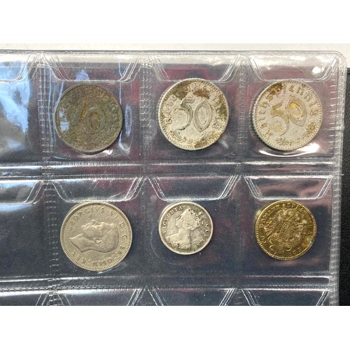 853 - Two books of British and world coins including some silver content.