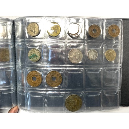 853 - Two books of British and world coins including some silver content.