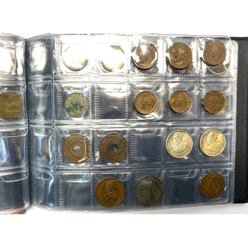 853 - Two books of British and world coins including some silver content.