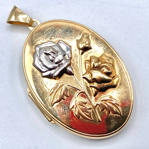 876 - 9ct gold and white gold rose emblemed locket 40mm x 25mm 6.1 grams.