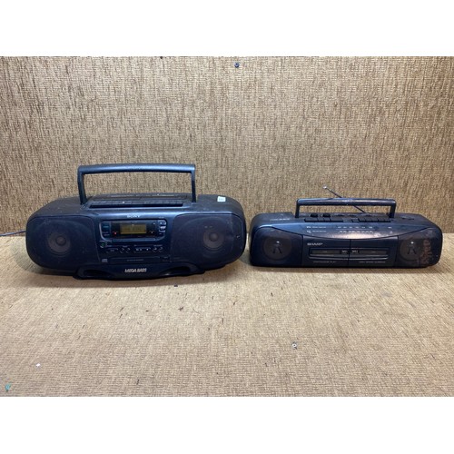 53 - 1990s sony boom box and a Sharp WQ-284 cassette player.