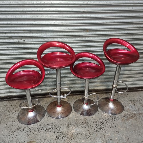 57 - Four red chrome bar stools.