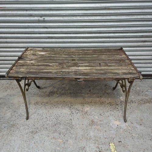 94 - Wood and cast iron garden table (wood requires work)