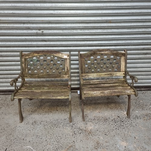 93 - Two wooden and cast iron garden chairs. (wood requires work)