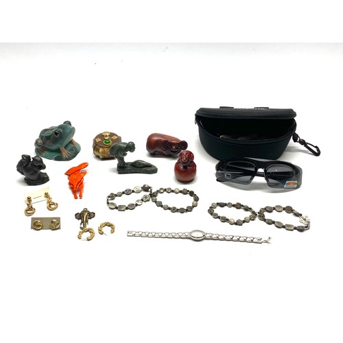 464 - Collectible items include costume jewellery boxed SUN glasses and a miniature hand cast sculptures.