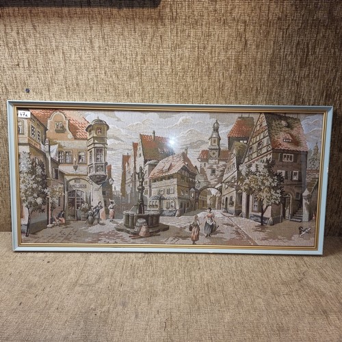 47A - Framed Tapestry of a village scene 108cm x 51cm.