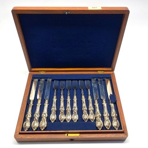 897 - Two tier set of fish knives and forks in an oak wooden presentation box.