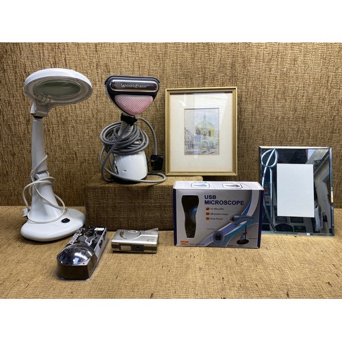 213 - Electricals including a clothes wrinkle eraser, a reading lamp and a USB microscope.