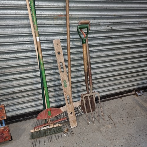 242 - Large selection of garden tools.