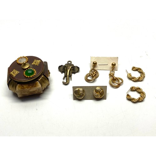 464 - Collectible items include costume jewellery boxed SUN glasses and a miniature hand cast sculptures.