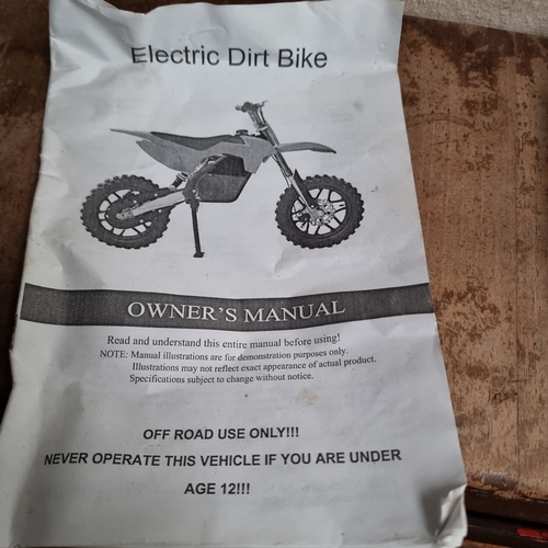 6 - XTM Electric off road dirt bike with power cable, owners manual and keys.