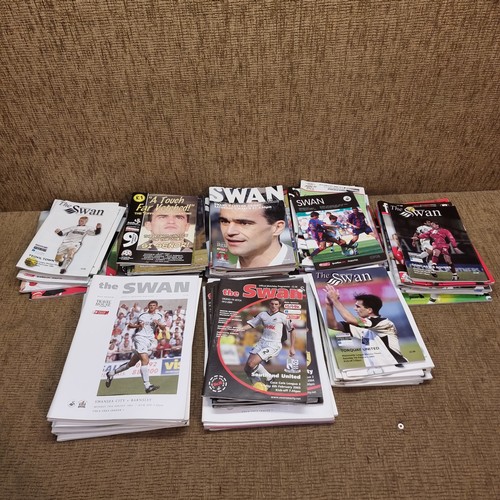 458 - A quantity of football programmes and magazines mostly Swansea FC programmes.