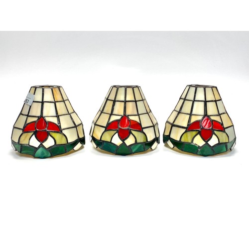 653 - Three tiffany style lamp shades. 13 x 14 cm .