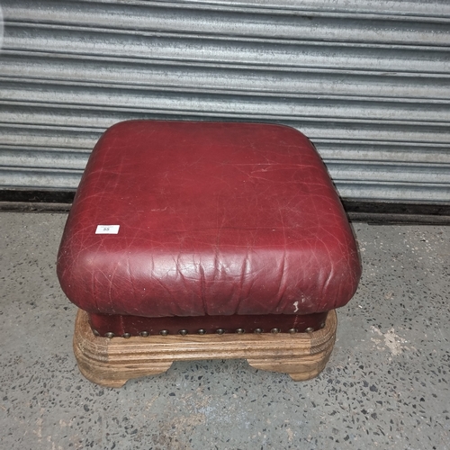 55 - Pine and ox blood leather foot stool.