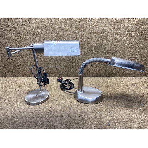 61 - Two stainless steel angle lamps.