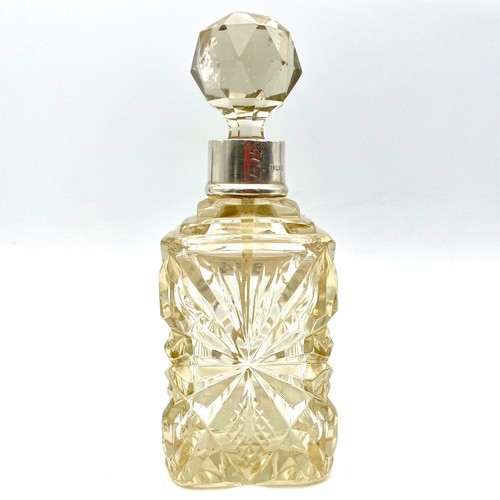 854 - Cut Crystal scent bottle with sterling silver collar 14cm tall. Circa 1900.