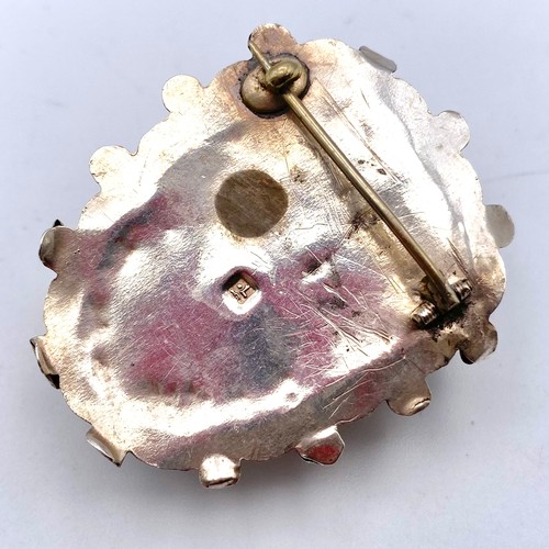 859 - Antique Silver and bone Egyptian brooch.