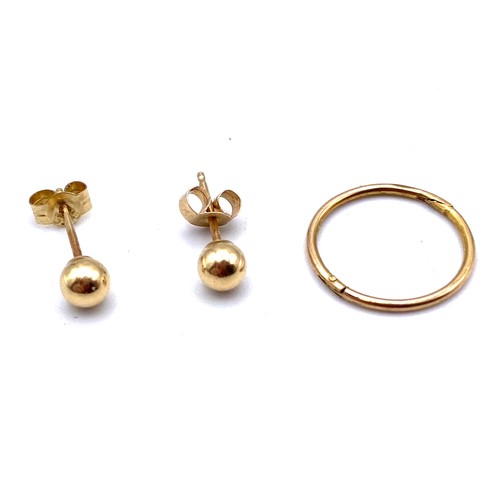 878 - 9ct gold stud earrings and one other.