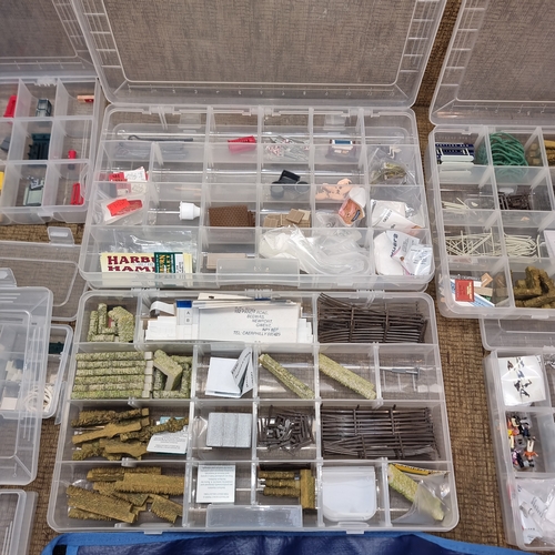 1108 - Selection of plastic storage containers full of model railway scenery.