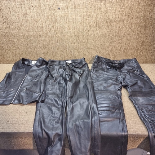 468 - Two pairs of leather trousers size 34 and a CCC of London leather waistcoat.