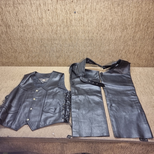 474 - Leather Ashy waistcoat size L and a pair of leather chaps.