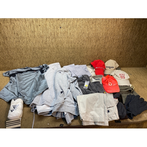 124 - Collection of men’s clothes mostly size L and some with retail labels including Nike, Adidas and Chi... 