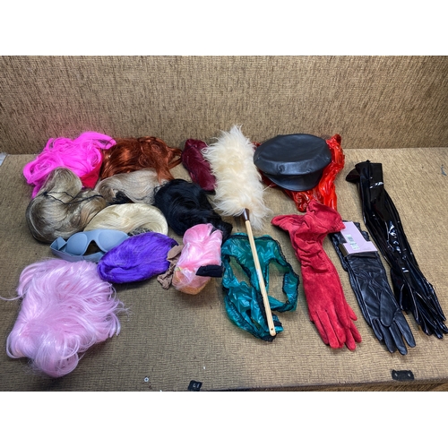 485 - Collection of wigs, hats and gloves.