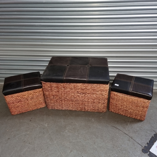 137 - Three wicker and leather topped storage boxes.