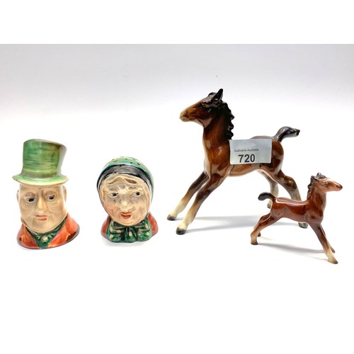 720 - Three pieces of beswick ceramics including salt and pepper shakers in the style of a victorian coupl... 