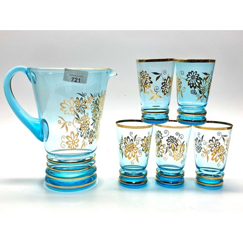 721 - Beautiful aqua marine glass pitcher and 5 glasses with gold floral decoration.