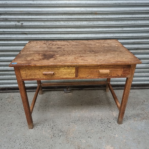 1200 - Solid oak mid century writing desk with twin drawers.