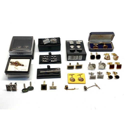 709 - Collection of  boxed and unboxed cufflinks and tie clip.