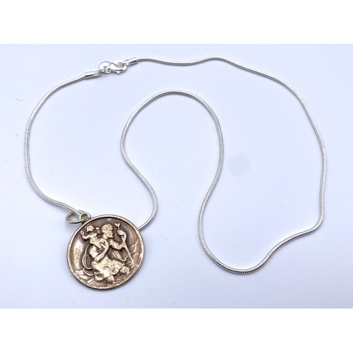 880 - Silver necklace with hallmarked large silver religious pendant (30mm).