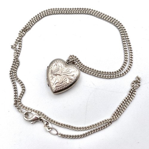 876 - Stirling sliver heart locket and silver chain.